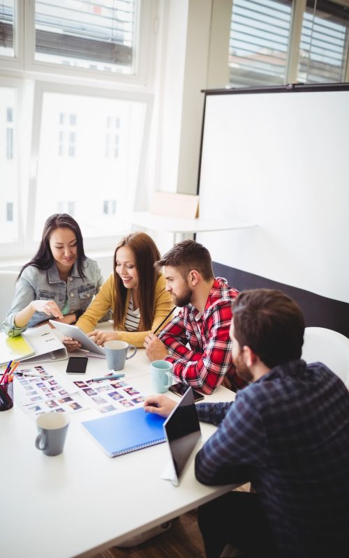 photo-editors-with-digital-tablet-in-meeting-room.jpg